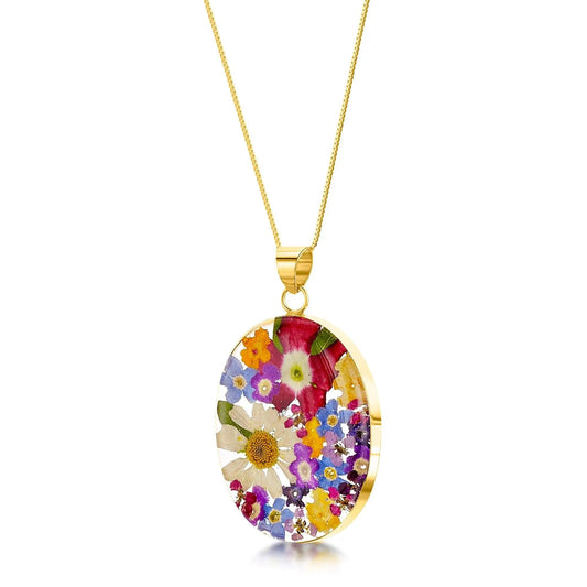 Gold-plated sterling silver oval pendant necklace with real flowers. Floral jewellery