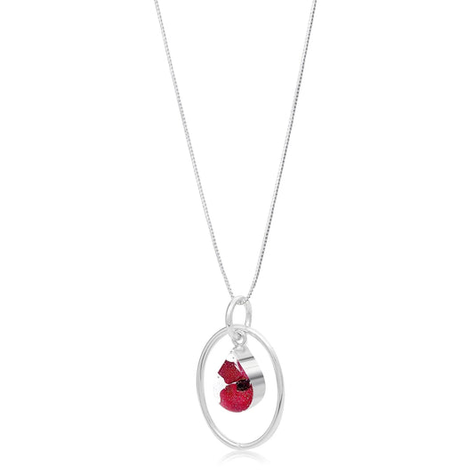 Sterling silver teardrop pendant with a mini poppy (Euphorbia Milii) & silver oval hoop.